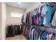 A well-organized walk-in closet offers ample hanging space and shelving for efficient clothing storage at 5777 Stephanie St, Charlotte, NC 28212