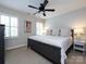 Bedroom featuring a ceiling fan and a plush bed, complemented by two windows with shuttered blinds at 5822 Alexa Rd, Charlotte, NC 28277