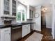Bright kitchen featuring stainless steel appliances, hardwood floors, and ample counter space at 5822 Alexa Rd, Charlotte, NC 28277