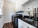 Functional laundry room with a sink, storage cabinets, washer, and dryer at 5822 Alexa Rd, Charlotte, NC 28277