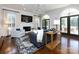 Cozy living room with fireplace, hardwood floors, comfortable seating, and ample natural light at 5822 Alexa Rd, Charlotte, NC 28277