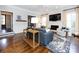 Bright living room with fireplace, large screen TV, hardwood floors, and stylish decor at 5822 Alexa Rd, Charlotte, NC 28277