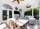 This screened porch features tile floors and vaulted ceilings, creating a luxurious outdoor living space at 5822 Alexa Rd, Charlotte, NC 28277