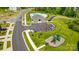 Aerial view of the community showcasing a pool, playground, clubhouse, and parking at 6256 Culbert St # 187, Harrisburg, NC 28075