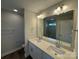 Bathroom featuring a double sink vanity, a large mirror, and a glass-enclosed shower at 6256 Culbert St # 187, Harrisburg, NC 28075