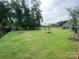 Spacious community dog park showcasing a well-maintained lawn and secure fencing for furry friends at 6256 Culbert St # 187, Harrisburg, NC 28075