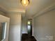 Bright entryway featuring tray ceilings, fresh paint, and hardwood floors, offering a modern welcome at 6256 Culbert St # 187, Harrisburg, NC 28075