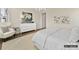 Bright bedroom with white dresser, rug, and decor at 6274 Chimney Bluff Rd, Lancaster, SC 29720