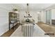 Dining room with wooden table, decorative light fixture and wainscotting at 6274 Chimney Bluff Rd, Lancaster, SC 29720