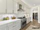 Modern kitchen with stainless steel appliances, custom cabinets, and a stylish backsplash at 6274 Chimney Bluff Rd, Lancaster, SC 29720