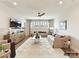 Bright living room featuring neutral tones, comfortable sofas, a ceiling fan, and a stylish entertainment center at 6274 Chimney Bluff Rd, Lancaster, SC 29720