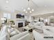 Spacious open living room with fireplace, light colored couches, and kitchen access at 6274 Chimney Bluff Rd, Lancaster, SC 29720