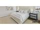 Main bedroom with white linens, blue nightstand, and large windows at 6274 Chimney Bluff Rd, Lancaster, SC 29720