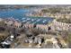 Scenic aerial view of waterfront homes, a marina with boats, and beautiful lake at 8221 Houser St, Cornelius, NC 28031