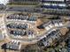 Aerial view of a well-planned community with tree-lined streets, sidewalks, and cul-de-sac at 8221 Houser St, Cornelius, NC 28031