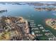 Picturesque aerial view featuring a marina, waterfront condos with a pool, and a large lake at 8221 Houser St, Cornelius, NC 28031