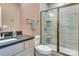 Elegant bathroom features a glass-enclosed shower, granite countertop, and modern fixtures at 8221 Houser St, Cornelius, NC 28031