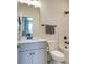 Well-lit bathroom featuring modern fixtures, a combined tub and shower, and a stylish vanity at 8221 Houser St, Cornelius, NC 28031