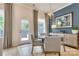 Dining area featuring modern decor, stylish chandelier, and door to the backyard at 8221 Houser St, Cornelius, NC 28031