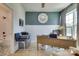Comfortable home office with desk and adjacent bathroom, featuring stylish decor, neutral tones, and a convenient layout at 8221 Houser St, Cornelius, NC 28031