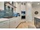 Modern kitchen features stainless steel appliances, stylish backsplash, and ample cabinet space for cooking needs at 8221 Houser St, Cornelius, NC 28031
