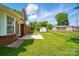 Spacious backyard with a red brick patio and fenced yard at 8309 Emily Dr, Harrisburg, NC 28075