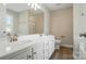 Bathroom featuring double vanity with modern faucets and lighting at 8309 Emily Dr, Harrisburg, NC 28075