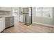 Bright and sunny kitchen area featuring a modern stainless steel refrigerator appliance at 8309 Emily Dr, Harrisburg, NC 28075