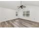 Airy bedroom with ample natural light, a ceiling fan, and wood-look flooring at 9013 Trellis Pointe Blvd, Charlotte, NC 28227