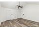 Spacious bedroom features high ceilings, a ceiling fan and sleek wood floors at 9013 Trellis Pointe Blvd, Charlotte, NC 28227