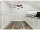 Bright dining area with stylish wainscoting, ceiling fan and sleek wood floors at 9013 Trellis Pointe Blvd, Charlotte, NC 28227
