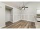 Dining area with hardwood floors, wainscoting, and ceiling fan at 9013 Trellis Pointe Blvd, Charlotte, NC 28227