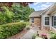 A charming stone and siding exterior with well-manicured landscaping creates curb appeal and an inviting entrance at 9013 Trellis Pointe Blvd, Charlotte, NC 28227