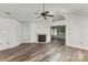Cozy living room with hardwood floors, a fireplace, and an open layout at 9013 Trellis Pointe Blvd, Charlotte, NC 28227