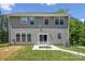 Spacious backyard featuring a patio with picnic table, lush lawn, and well-maintained exterior of the house at 9115 Providence S Rd, Waxhaw, NC 28173