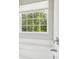 Garden bathtub is adjacent to a window overlooking an outdoor view of a lush green treeline providing privacy at 9115 Providence S Rd, Waxhaw, NC 28173