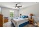 Cozy bedroom with soft carpet, natural light and ceiling fan at 9115 Providence S Rd, Waxhaw, NC 28173