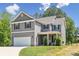Charming two-story home featuring a two-car garage, covered porch, and well-maintained lawn at 9115 Providence S Rd, Waxhaw, NC 28173
