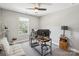Bright home office features modern desk setup, a ceiling fan, and a window for natural light at 9115 Providence S Rd, Waxhaw, NC 28173