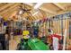 Inside view of a shed featuring a well organized workspace, a vaulted ceiling and an array of tools at 9115 Providence S Rd, Waxhaw, NC 28173