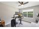 Home office setup features a standing desk, dual monitors, ergonomic chair, and a window with natural light at 9115 Providence S Rd, Waxhaw, NC 28173
