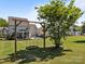 Fun backyard featuring a wooden framed swing for outdoor activities and entertainment at 9871 Travertine Trl, Davidson, NC 28036