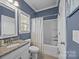 Bathroom featuring a granite countertop vanity, tub, and shower combination at 9871 Travertine Trl, Davidson, NC 28036
