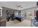 This bedroom features many built-ins, a ceiling fan, neutral paint, and an office space at 9871 Travertine Trl, Davidson, NC 28036