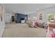 Vast upstairs living room with neutral carpeting, and a large sofa at 9871 Travertine Trl, Davidson, NC 28036