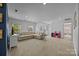 Spacious upstairs living room features neutral carpeting, recessed lighting, and ample natural light at 9871 Travertine Trl, Davidson, NC 28036