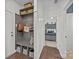 Functional mudroom features built-in bench, storage shelves, and convenient access to the bedroom at 9871 Travertine Trl, Davidson, NC 28036
