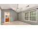 Bright bedroom with neutral paint, vaulted ceiling, and large window at 10421 Columbia Crest Ct, Charlotte, NC 28270