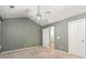 Neutral bedroom with ceiling fan, and easy access to the en suite bathroom at 10421 Columbia Crest Ct, Charlotte, NC 28270