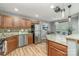 Modern kitchen featuring stainless steel appliances, granite countertops, and stylish lighting at 10421 Columbia Crest Ct, Charlotte, NC 28270